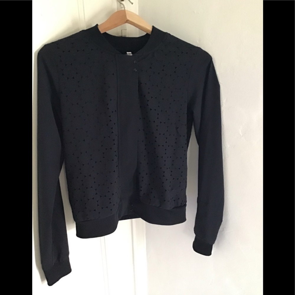 Black jacket with design holes that are lined
